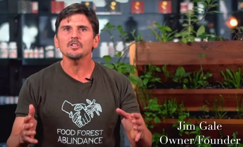 Jim Gale, founder of The Stewardship Party, speaking to camera in a Food Forest Abundance shirt